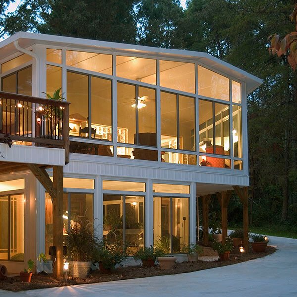 A luxurious two-story sunroom in Kansas City property.