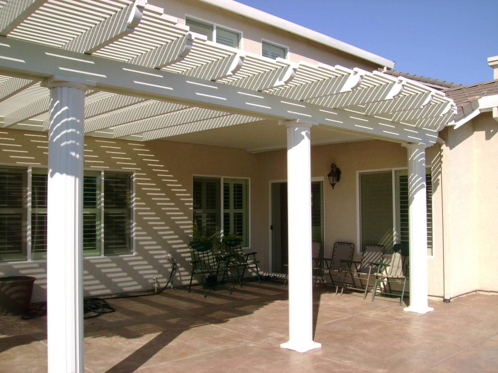 A louvered pergola installed in a residential property.